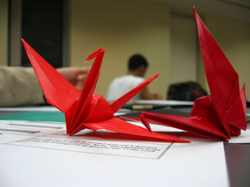 Two red paper cranes.