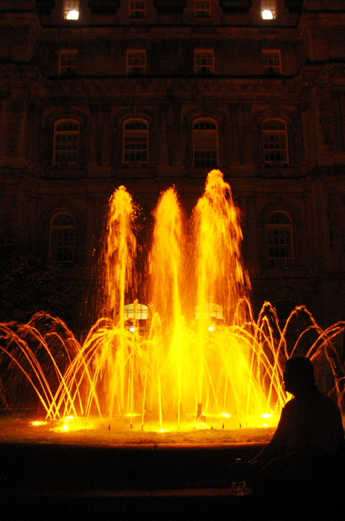 A fountain at night in downtown Montreal.