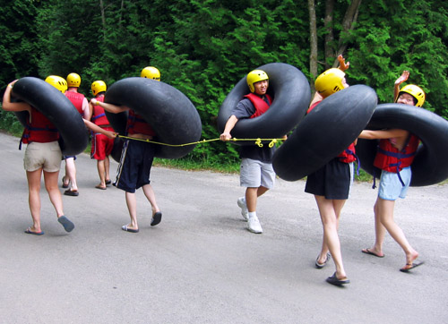 Shima's friends walking together in their tubing gear.