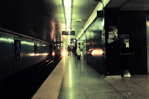The subway arrives at a subway station.