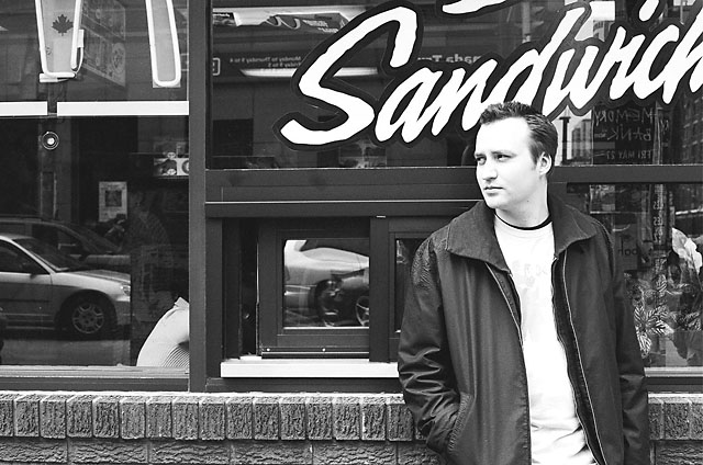 Dave leaning against the McDonald's window at Spadina.