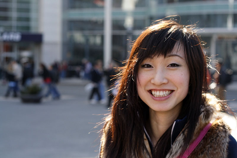 Yusu smiling in Dundas Square.