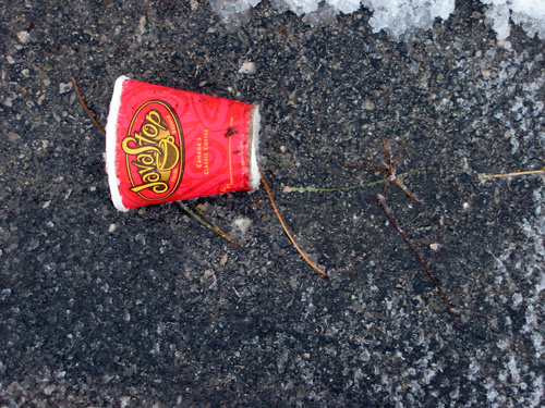 A coffee cup next to one of the RIM buildings.