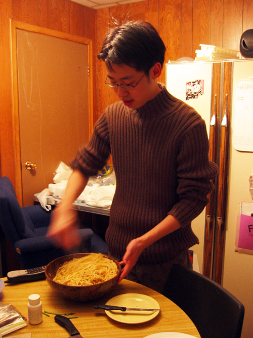 Matt stirring the pasta.