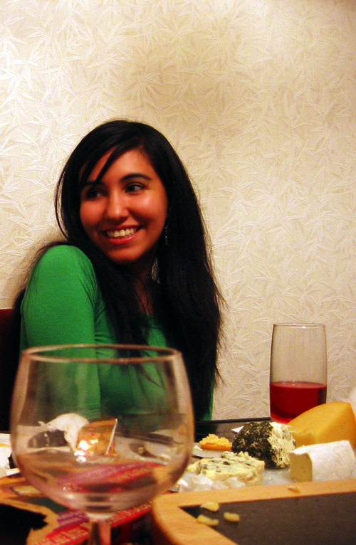 Sanaz sitting in Riadhs' dining room.