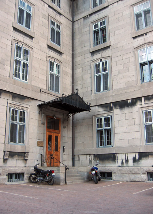 A building inside a courtyard in Montreal.