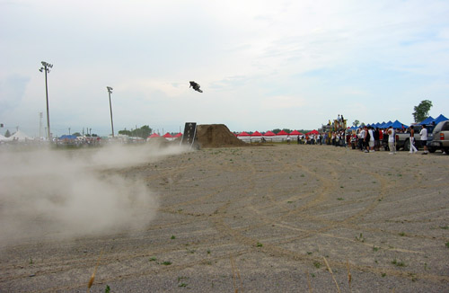 A dirt bike makes an impressive jump.