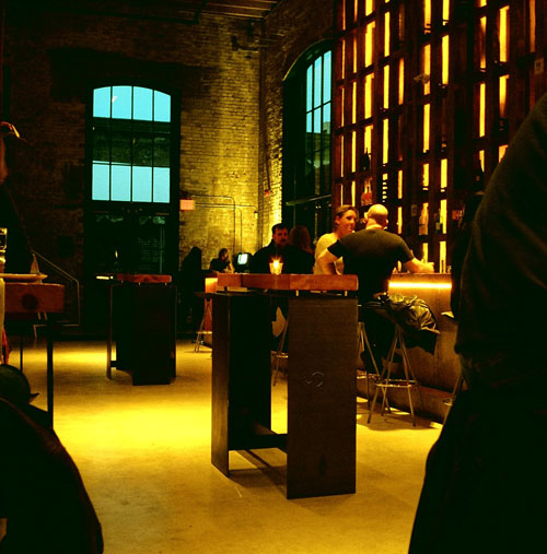 A couple sitting at the bar in the Broiler House.