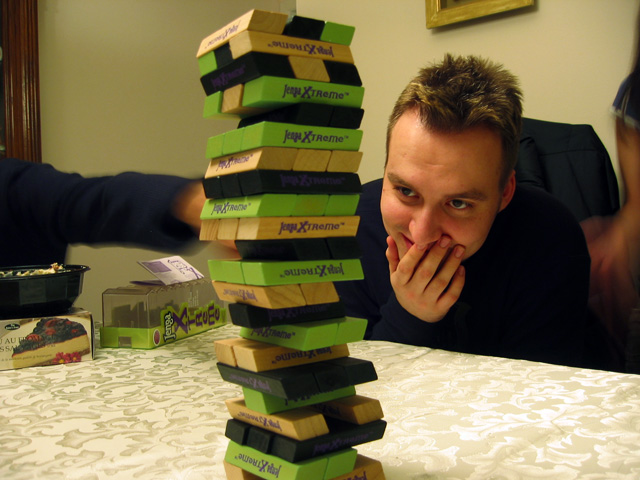 Dave playing Jenga in my dining room.