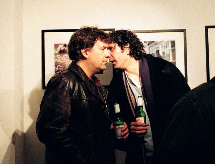 Two fellows talking at the PubliCITY exhibit.