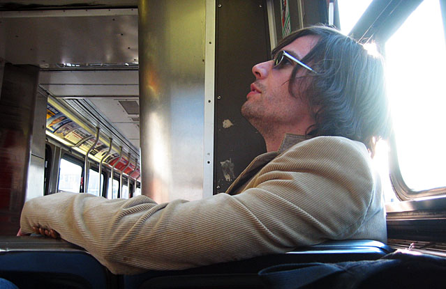 Tyler sitting on the Queen Street St. car.