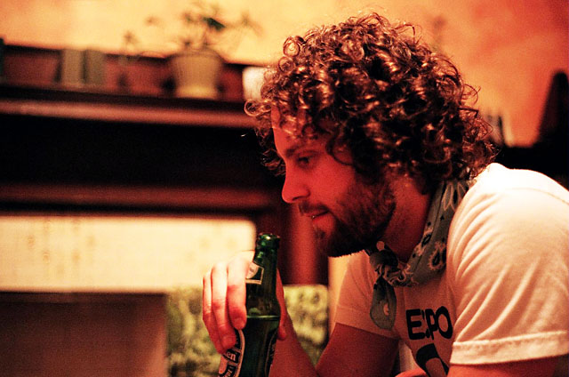 Matt drinking a beer at Laura's house.