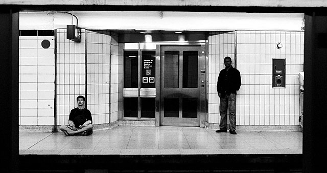 Bahi standing on the East bound platform at Spadina Station.