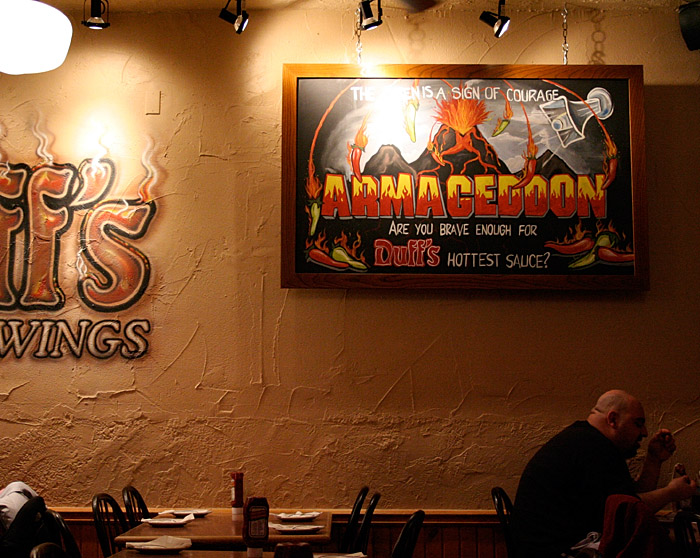 A man eating wings at Duff's.