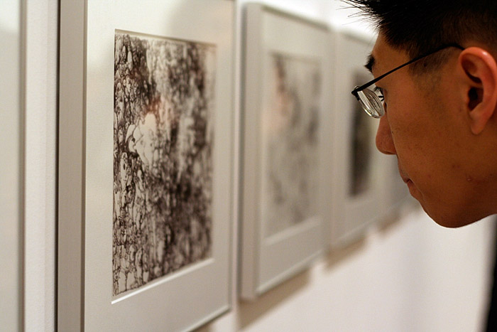 Patrick enjoys some art by Jean-Pierre Larocque.